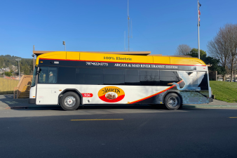 A&MRTS Electric Bus outside of City Hall