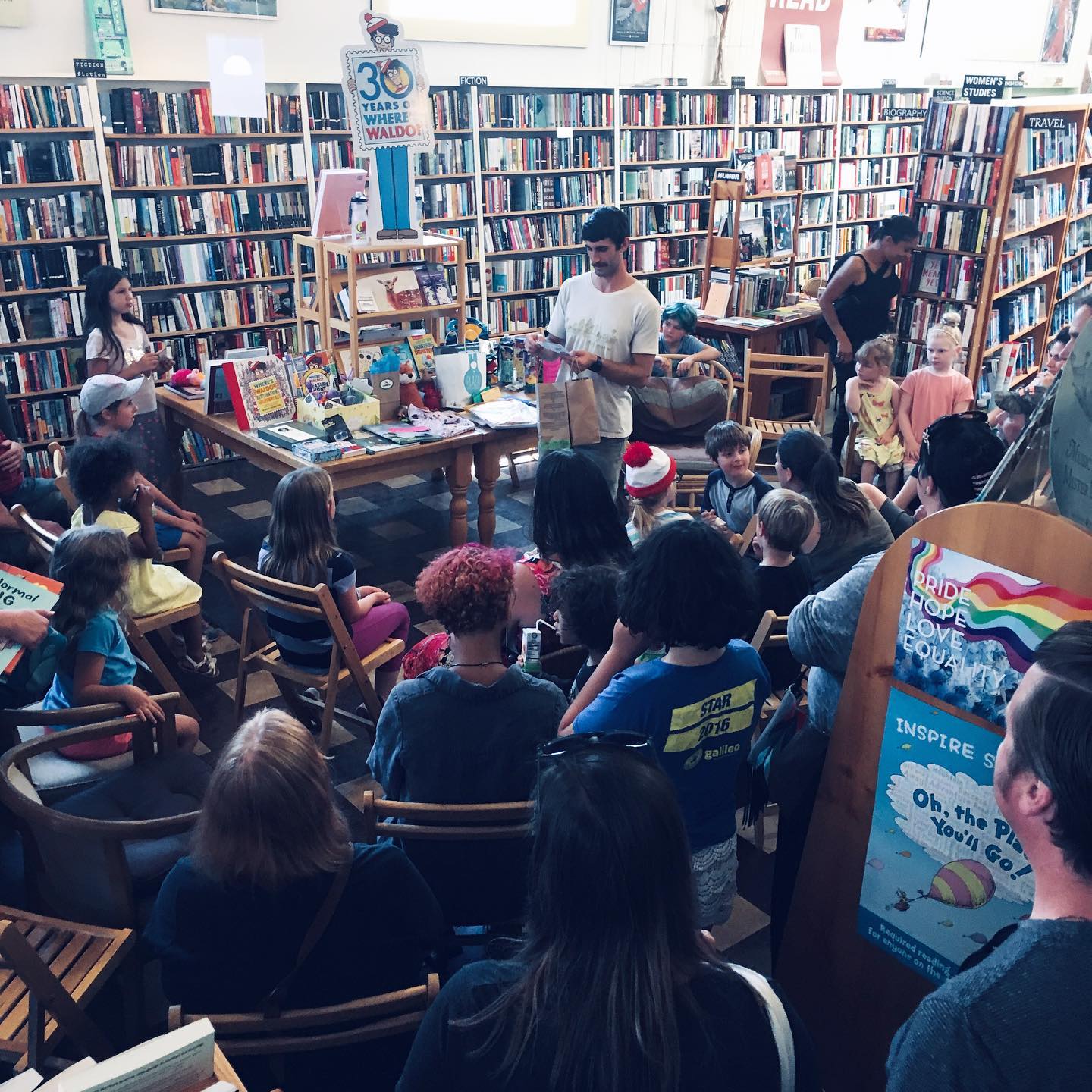 An event with people happening in the interior of Northtown Books
